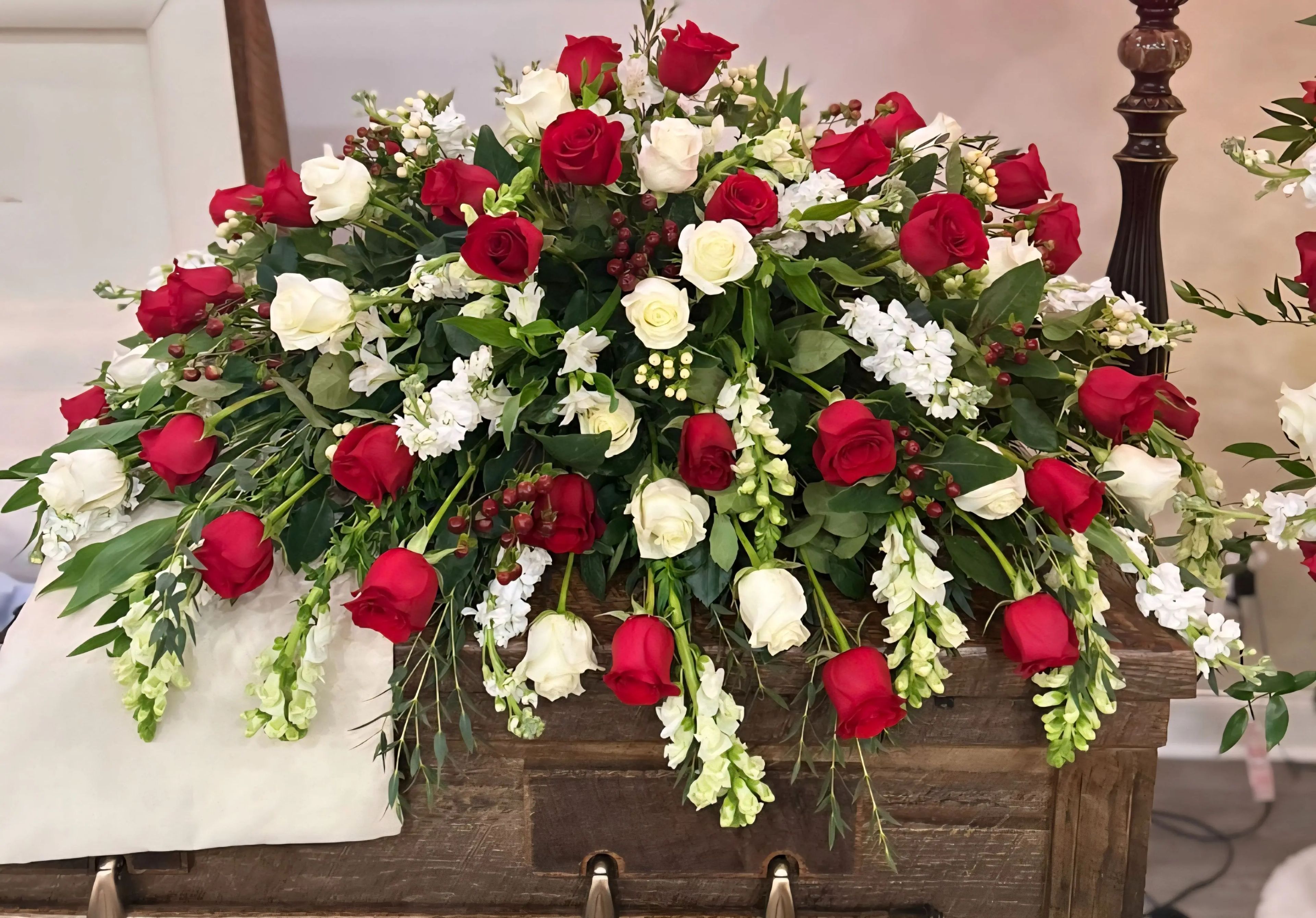 Red and white casket spray