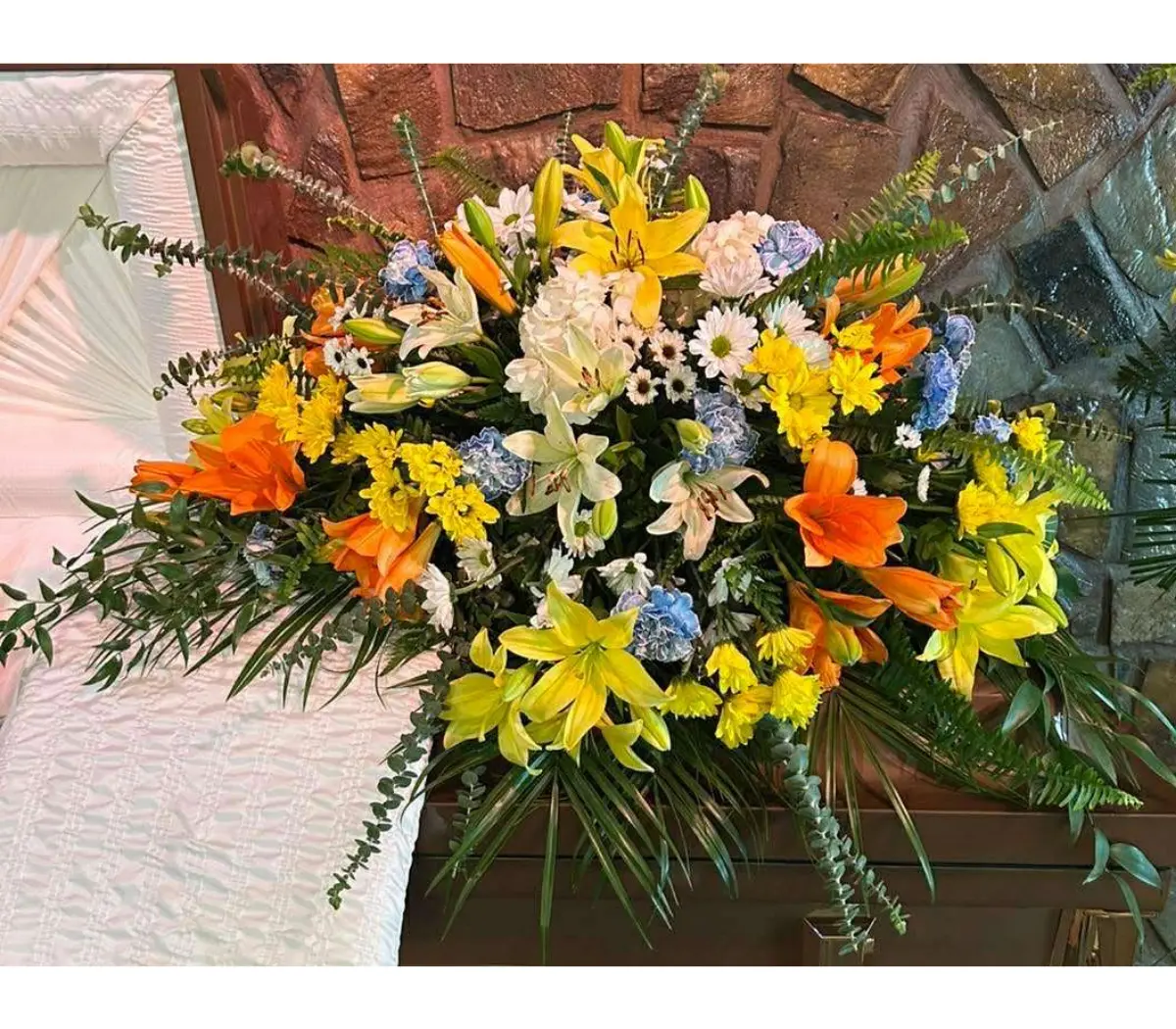 Sunshine and blues casket spray Sunshine and blues casket spray