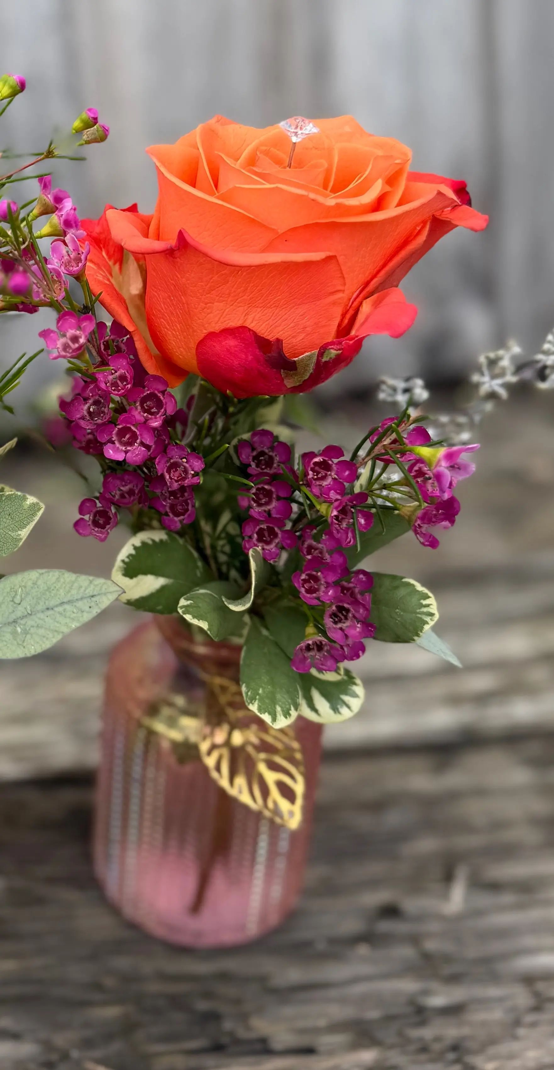 Orange rose bud vase