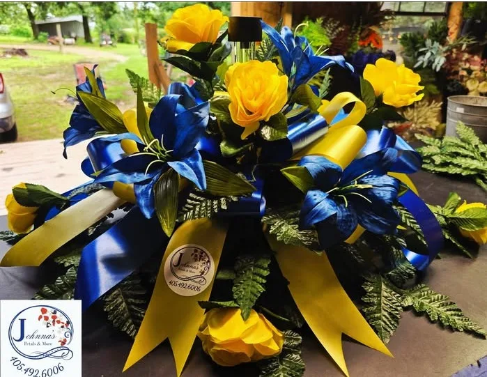 Blue and Yellow Silk Spray on brick with solar Silk Arrangement Blue and Yellow Silk Spray on brick with solar Silk Arrangement
