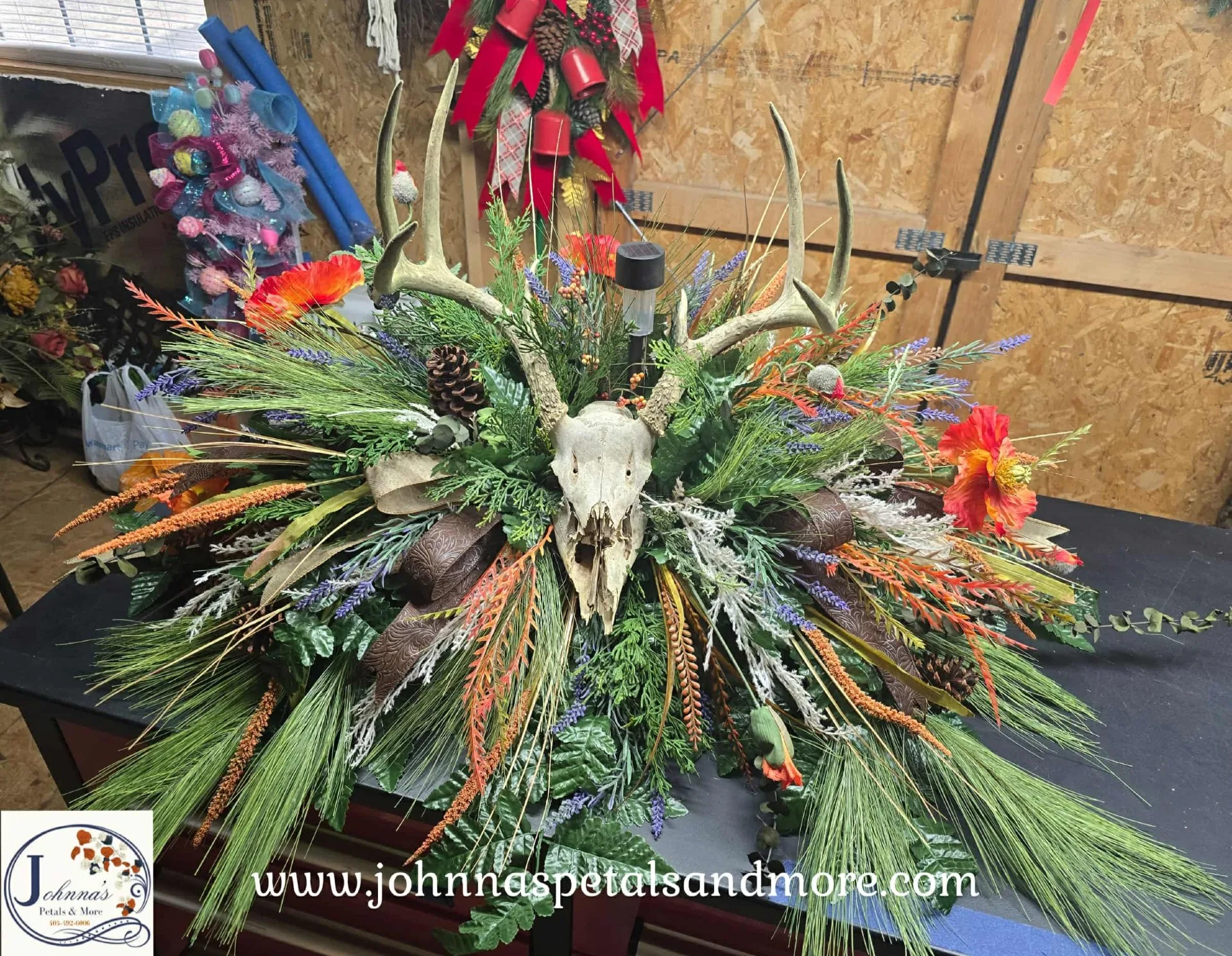 Rustic Deer Skull Themed Silk Cemetery Floral on brick with solar light Rustic Deer Skull Themed Silk Cemetery Floral on brick with solar light