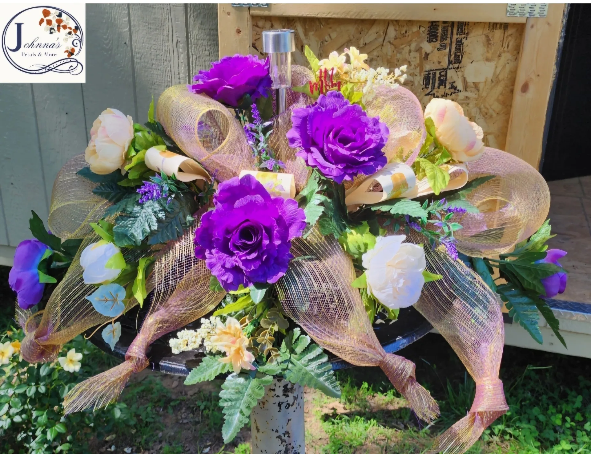 Silk Spray On A Brick With Solar Light Purples, Creams & White With Mesh Ribbon Silk Spray On A Brick With Solar Light Purples, Creams & White With Mesh Ribbon