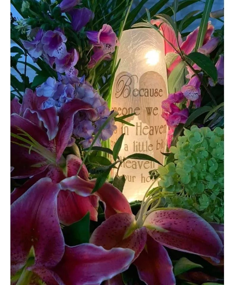 We know someone in Heaven Light Electric Light, Flowers are custom added per budget