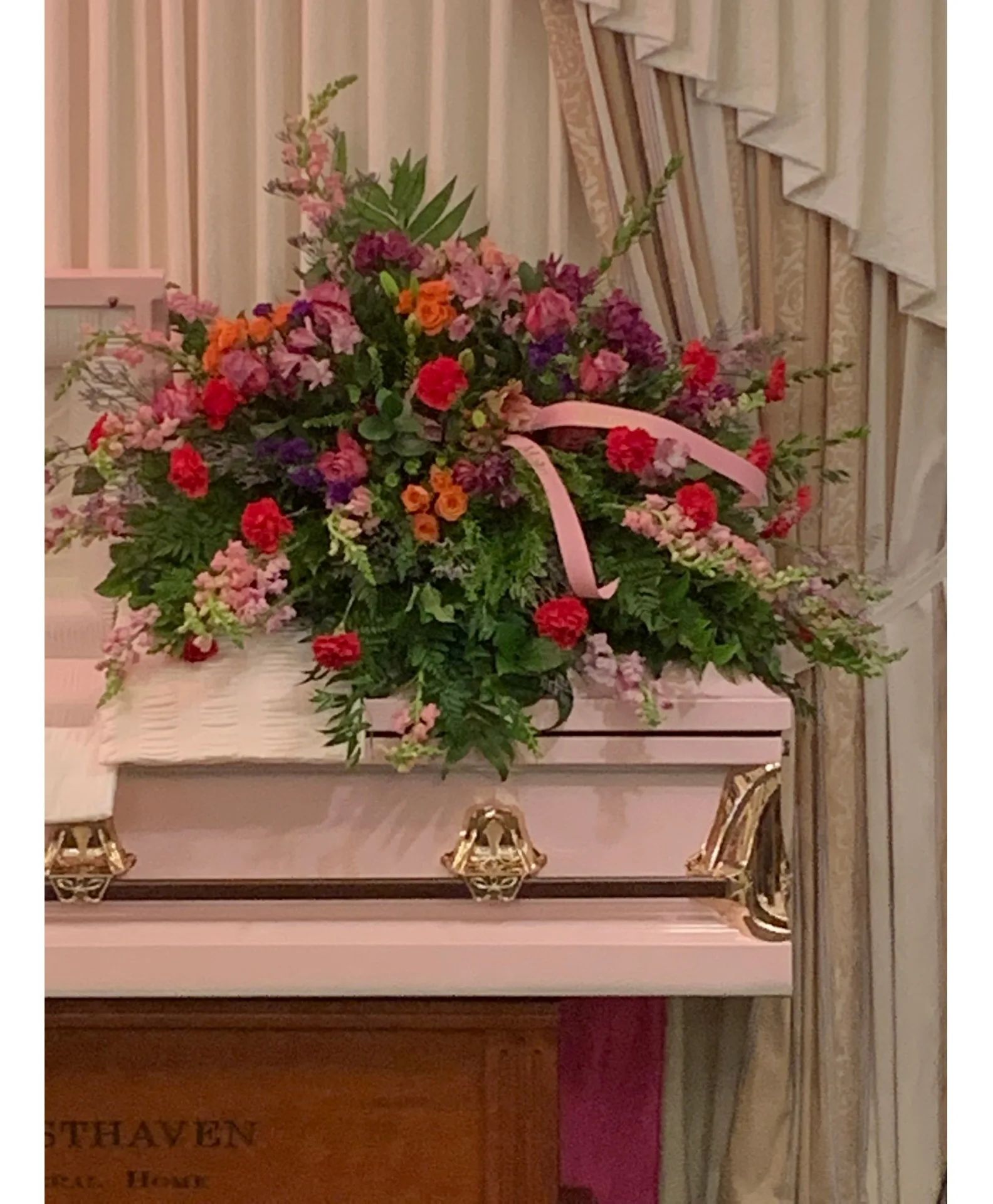 Ladies Top Choice Casket Spray Shown in pinks