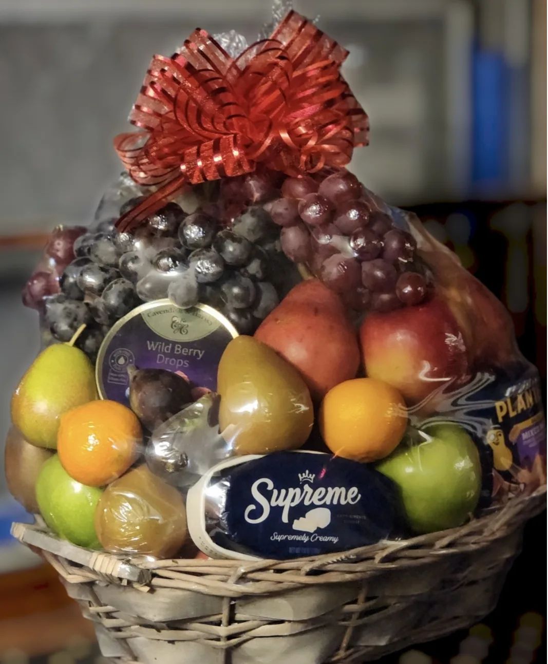 Custtom Hand made fruit basket. Made from fresh fruit , cheese, cracks and candys.