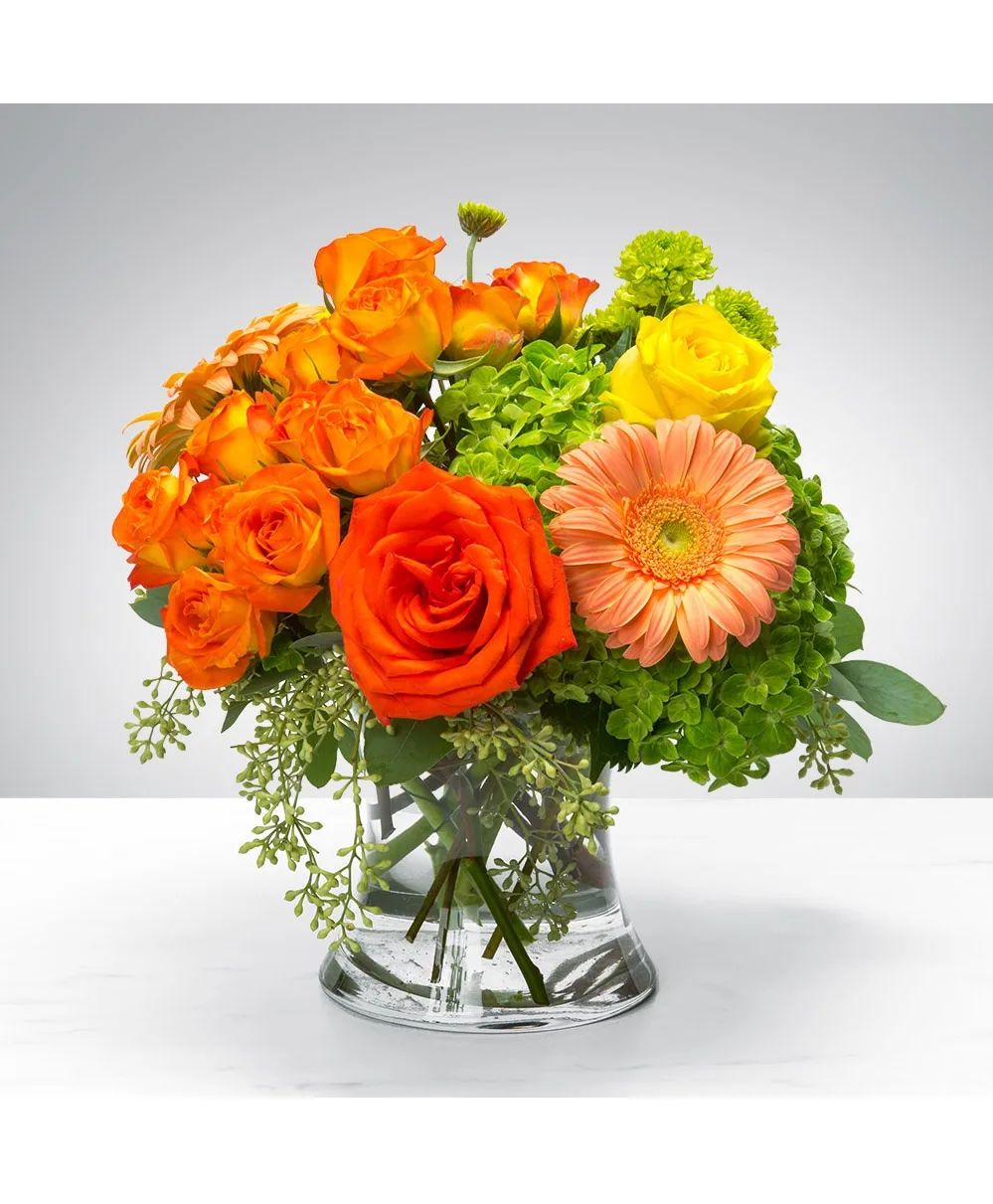 Citrus Glow Modern Compact Floral Arrangement in Clear Glass Vase